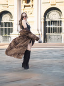 Espresso Mink Long Coat - Regal Swing flaring in motion, styled with black mini dress and boots for high-end winter fashion.
