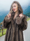 a woman in a fur coat posing for a picture
