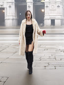 Beige Mink Fur Coat - Vintage Luxury worn over black mini dress. Elegant outerwear for upscale winter styling.