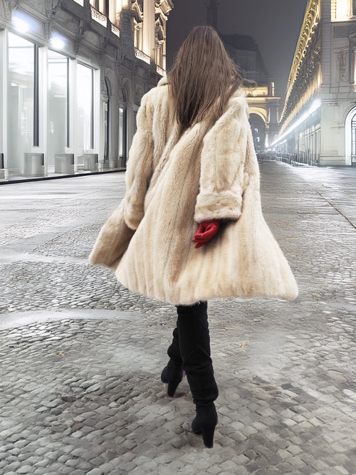 Beige Mink Fur Coat - Vintage Luxury shown from back in motion. Timeless fur coat for elegant winter wardrobes.