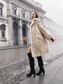 Vintage Beige Pearl Mink Fur Coat S/M in motion on city street. Classic mink coat for fashionable winter layering.