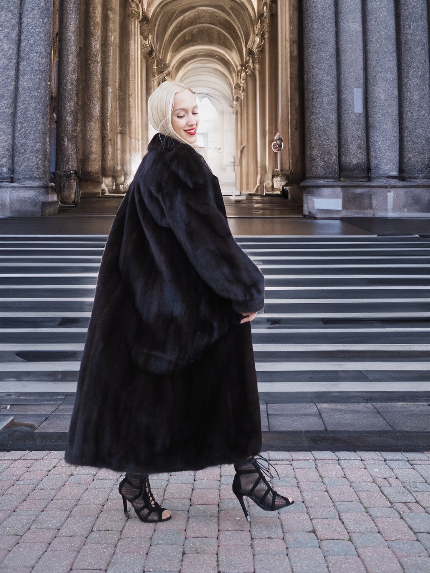 Luxurious black mink fur coat, elegant woman stands on steps of grand building