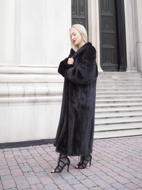 Luxurious black mink fur coat with elegant silhouette, showcasing premium Canadian craftsmanship.