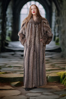 Woman wearing a fur coat standing in a stone archway.