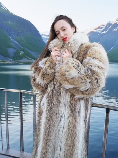 Close-up of plush collar and thick fur texture on Vintage Coyote Fur Coat, styled beside a tranquil alpine lake.