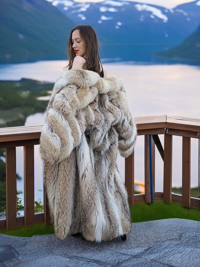 Vintage Coyote Fur Coat - Wild Luxury, 50" long with plush collar and natural texture, styled outdoors by a scenic lake view.