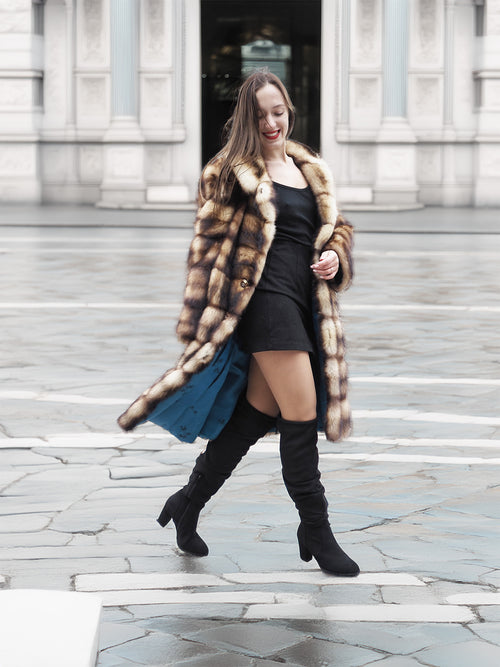 Fur coat with horizontal striped design, button front and stand-up collar