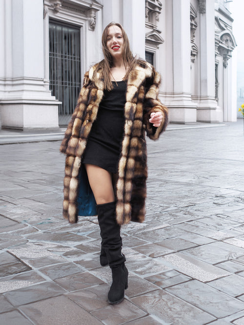 Horizontal striped fur coat with button front, standing collar, and long sleeves