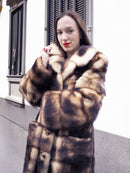 Fur coat in horizontal stripe design, buttoned front and textured collar