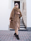 Elegant vintage-style Canadian mink fur coat, worn by fashionable woman standing on steps.
