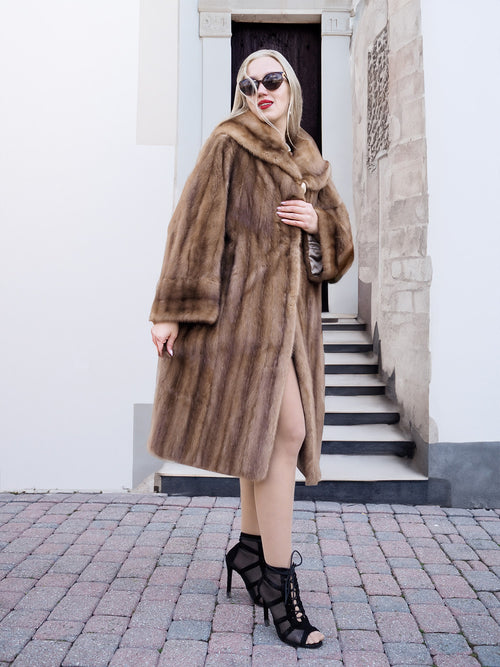 Elegant vintage-style Canadian mink fur coat, worn by fashionable woman standing on steps.