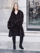 Model wearing XL/XXL mahogany mink swing coat with flared sleeves and soft sheen. Luxury fur outerwear for cold-weather sophistication.