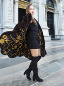 Gold baroque lining of XL/XXL mahogany mink swing coat displayed mid-twirl. Elegant winter fur fashion with luxurious detail.