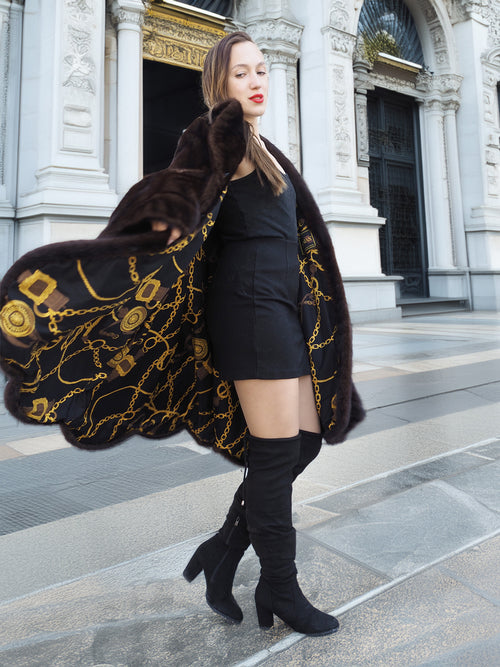 Gold baroque lining of XL/XXL mahogany mink swing coat displayed mid-twirl. Elegant winter fur fashion with luxurious detail.