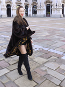 Model spinning in XL/XXL mahogany mink coat revealing ornate gold baroque lining. Luxury fur outerwear for winter chic.