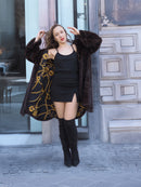 Front view of XL/XXL mahogany mink swing coat with arms open to show lining. Elegant real fur coat for cold-weather fashion.