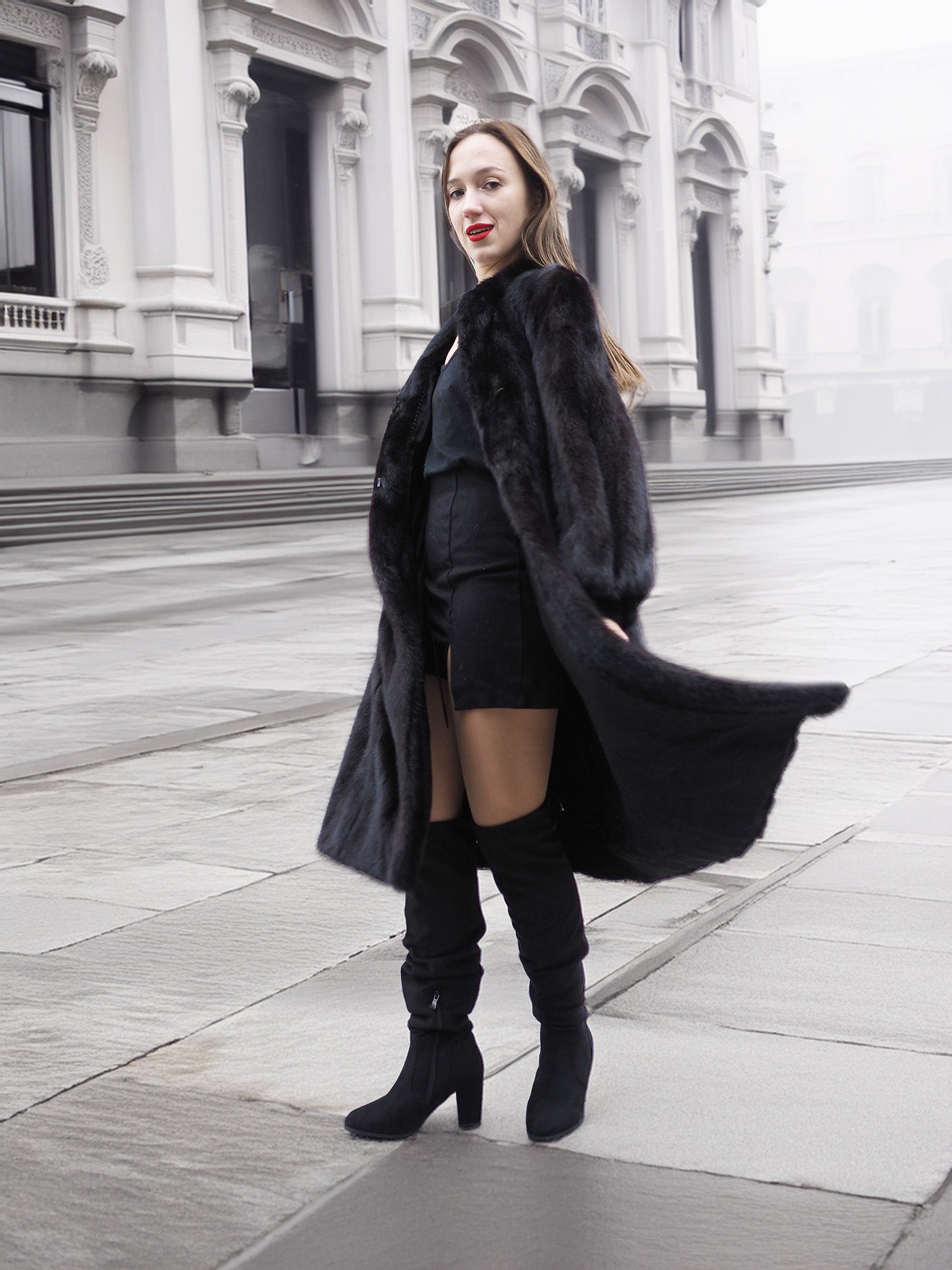 Stylish black mink fur coat paired with thigh-high boots, perfect for chic winter fashion and luxury outerwear.