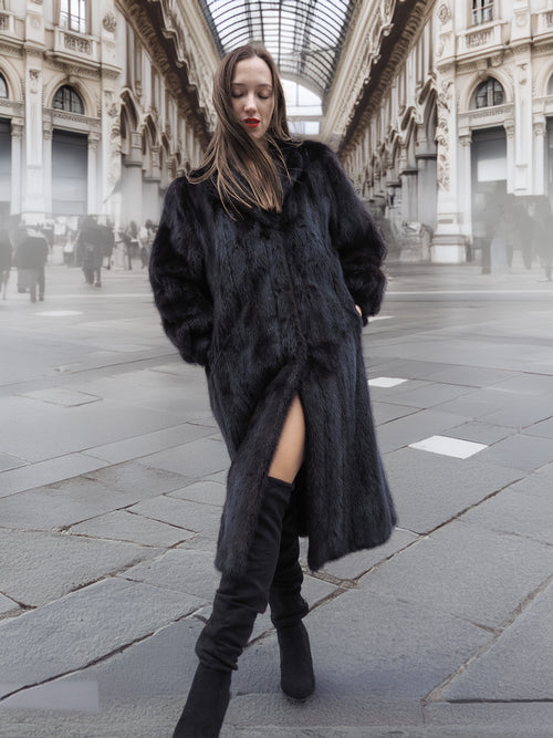 Dark Ranch Black Mink Fur Coat in classic design, full-length with wing collar and side pockets, styled for winter outerwear fashion.