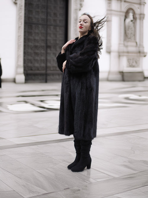 Luxury black mink fur coat with voluminous sleeves and satin lining, ideal for cold-weather elegance and premium fur fashion.