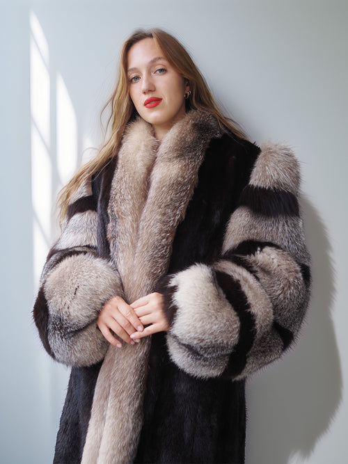 Woman wearing a fur coat with a neutral background
