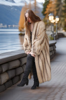 Ivory full-length raccoon coat, open front, long sleeves, side view