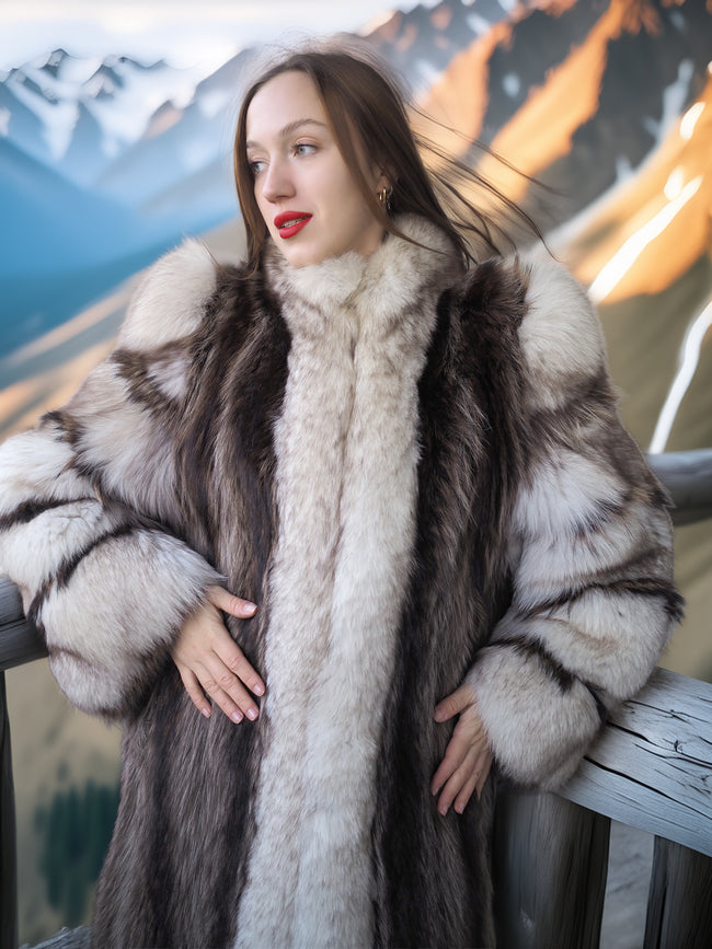 Woman wearing a fur coat with a mountainous landscape in the background