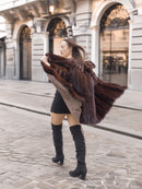 Full-length mahogany mink coat in motion, highlighting its voluminous silhouette and natural fur sheen for luxury outerwear.