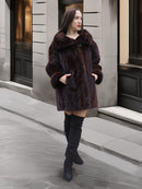 Classic mink coat with wide collar and cuffed sleeves, styled for luxury outerwear in a modern city backdrop.