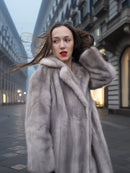 Sapphire Grey Mink Fur Coat S/M Excellent close-up with wind-blown hair. Premium mink coat showcasing soft texture and elegant winter styling.