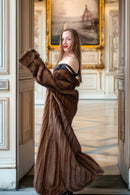 Brown mink fur coat with open front and rounded collar button detail
