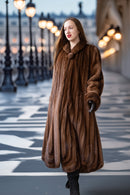 Brown mink fur coat with oversized collar and full-length silhouette