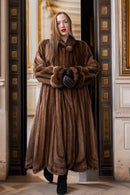 Brown full-length mink fur coat with large collar and sculpted cuff detail