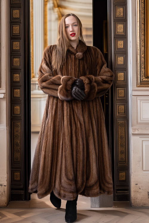 Brown full-length mink fur coat with large collar and sculpted cuff detail