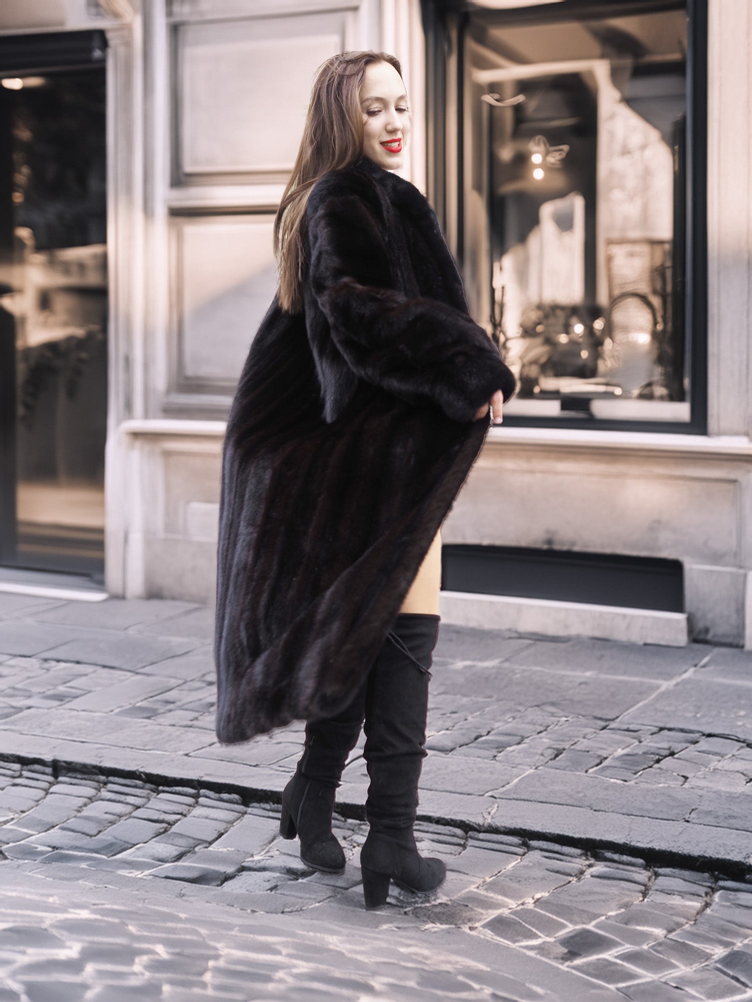 Back view of woman in Midnight Sonata black mink coat, showing off the coat’s voluminous silhouette and rich fur detail.