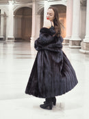 Midnight Sonata black mink coat in motion outdoors, blending real fur fashion with graceful winter styling.