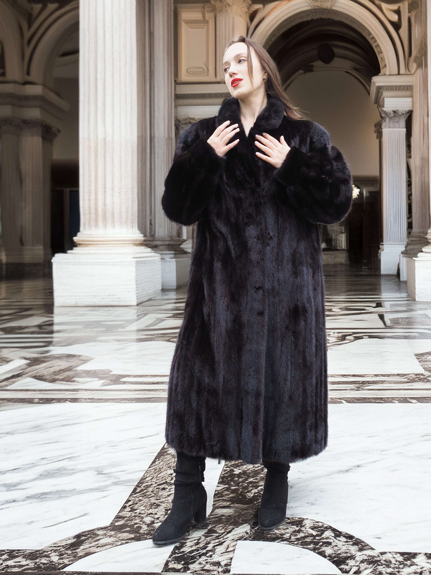 Midnight Sonata black mink coat styled in a neoclassical hall, emphasizing timeless elegance and premium fur craftsmanship.