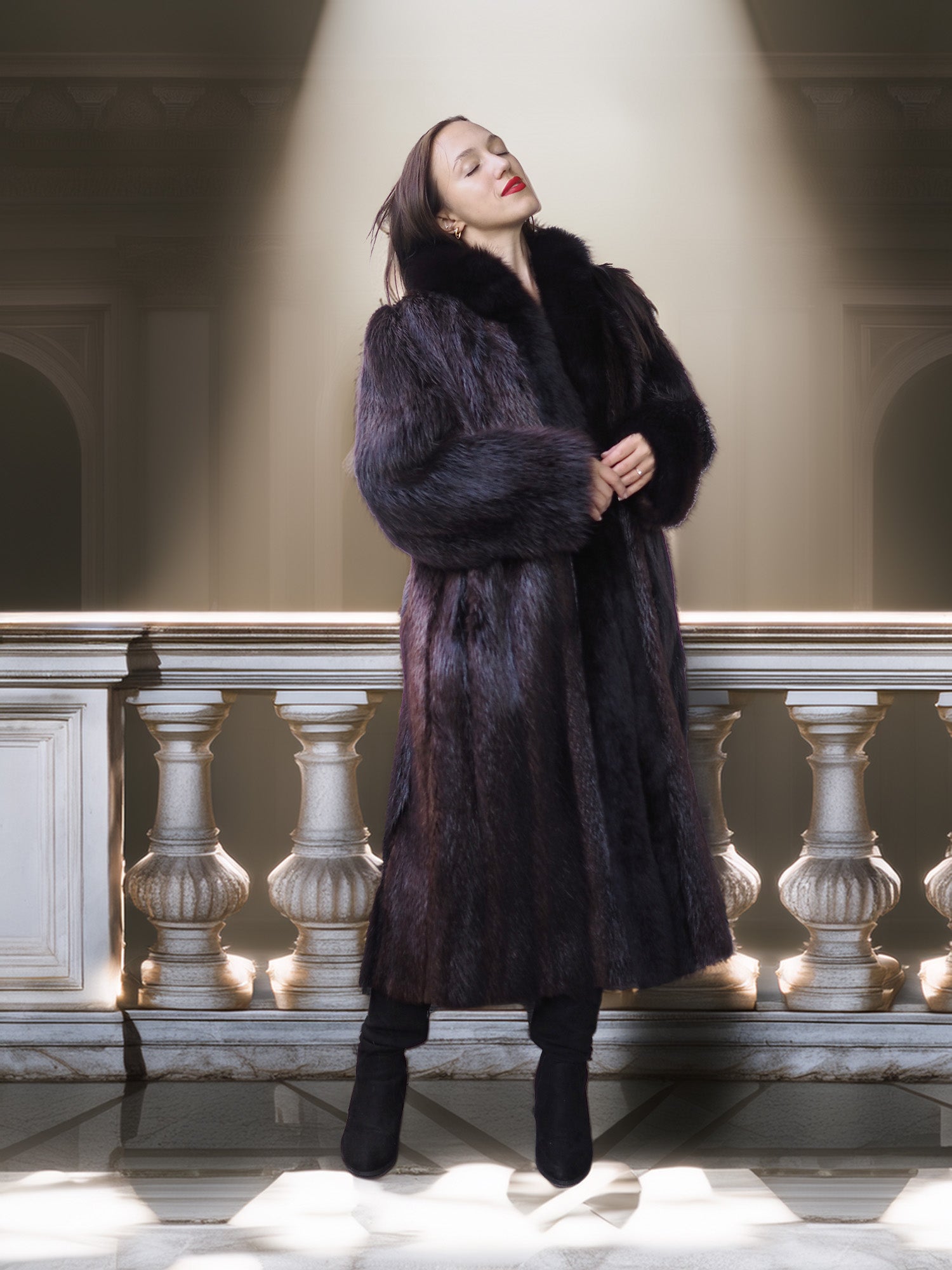 Woman wearing a fur coat standing in a grand hall with a spotlight on her.