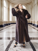Woman wearing a fur coat in an elegant interior setting