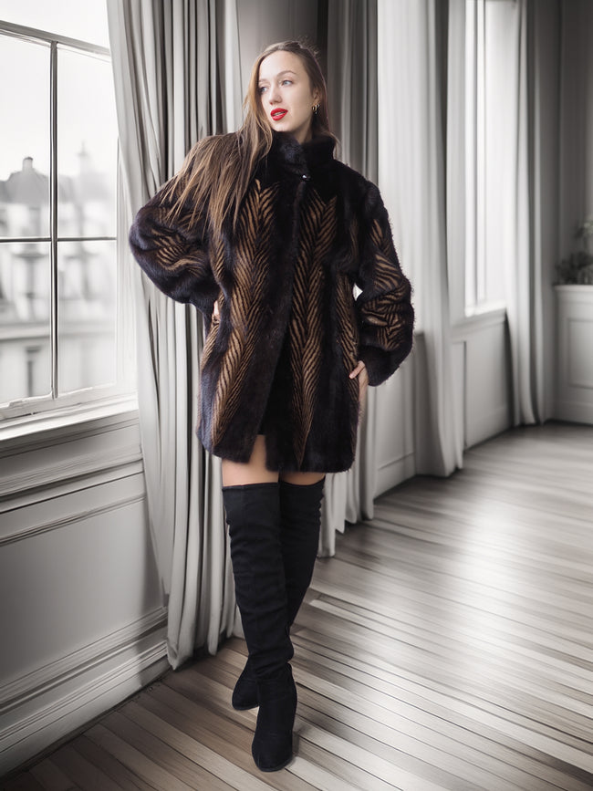 Woman wearing a fur coat and black boots in a room with large windows.