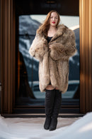 Raccoon fur coat in golden honey tones, front open with structured lapels