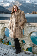 Honey raccoon fur coat with high collar and full, flowing silhouette in chestnut tones