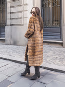 Back view of Harlow pastel mink shawl collar coat, highlighting the horizontal mink pelt pattern and mid-length cut.