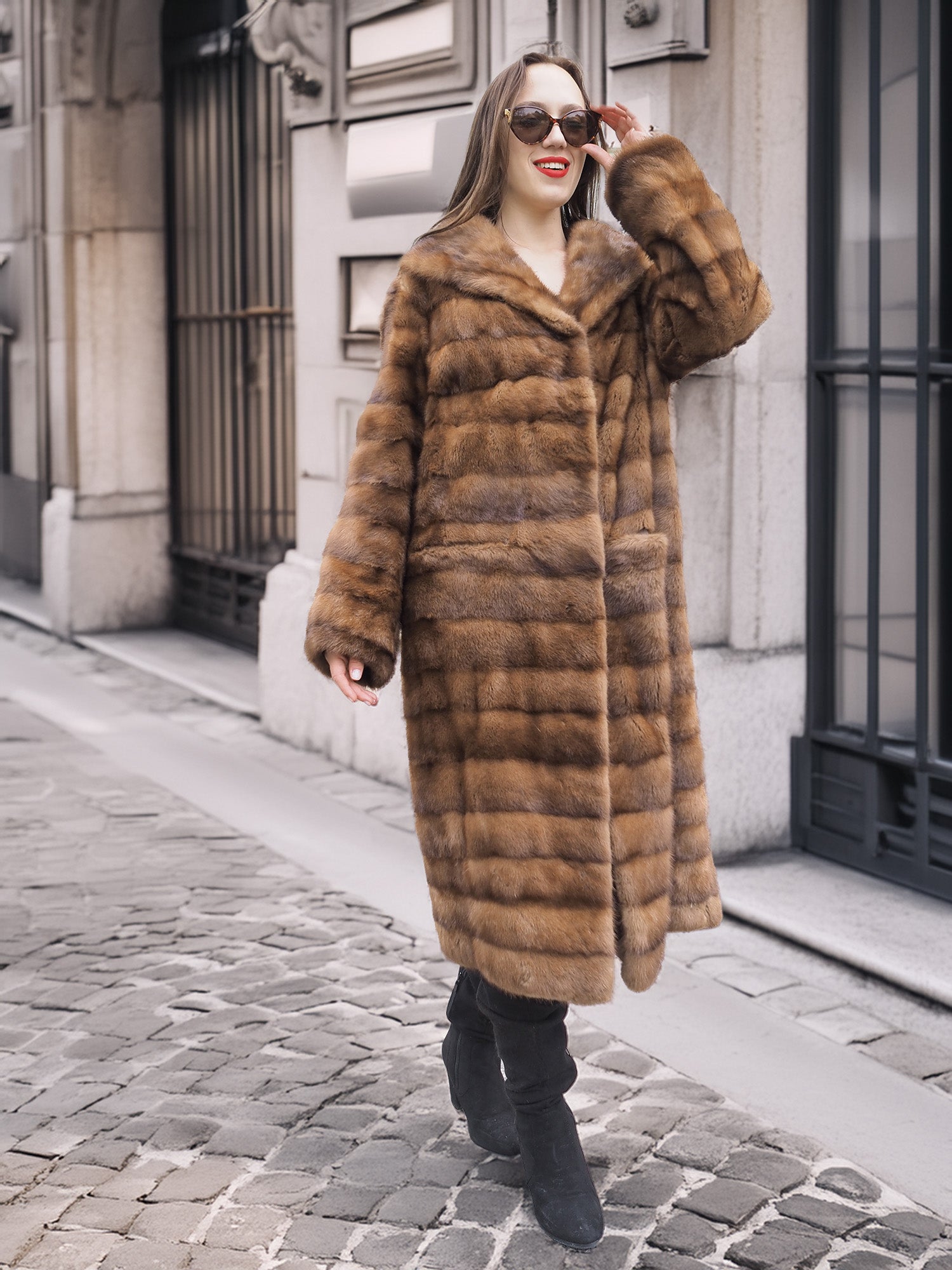 Full-length view of Harlow pastel mink coat with shawl collar, worn buttoned up for a classic and elegant winter outfit.