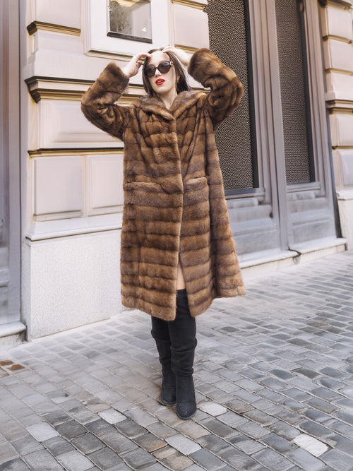 Chic Harlow pastel mink coat with shawl collar, styled with red lipstick and sunglasses for a timeless vintage outerwear look.