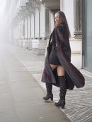 Side view of open red and black mink fur coat revealing black outfit underneath, perfect for chic winter layering.