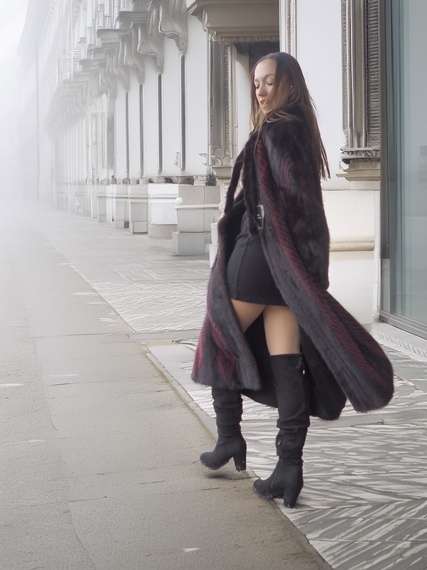 Side view of open red and black mink fur coat revealing black outfit underneath, perfect for chic winter layering.
