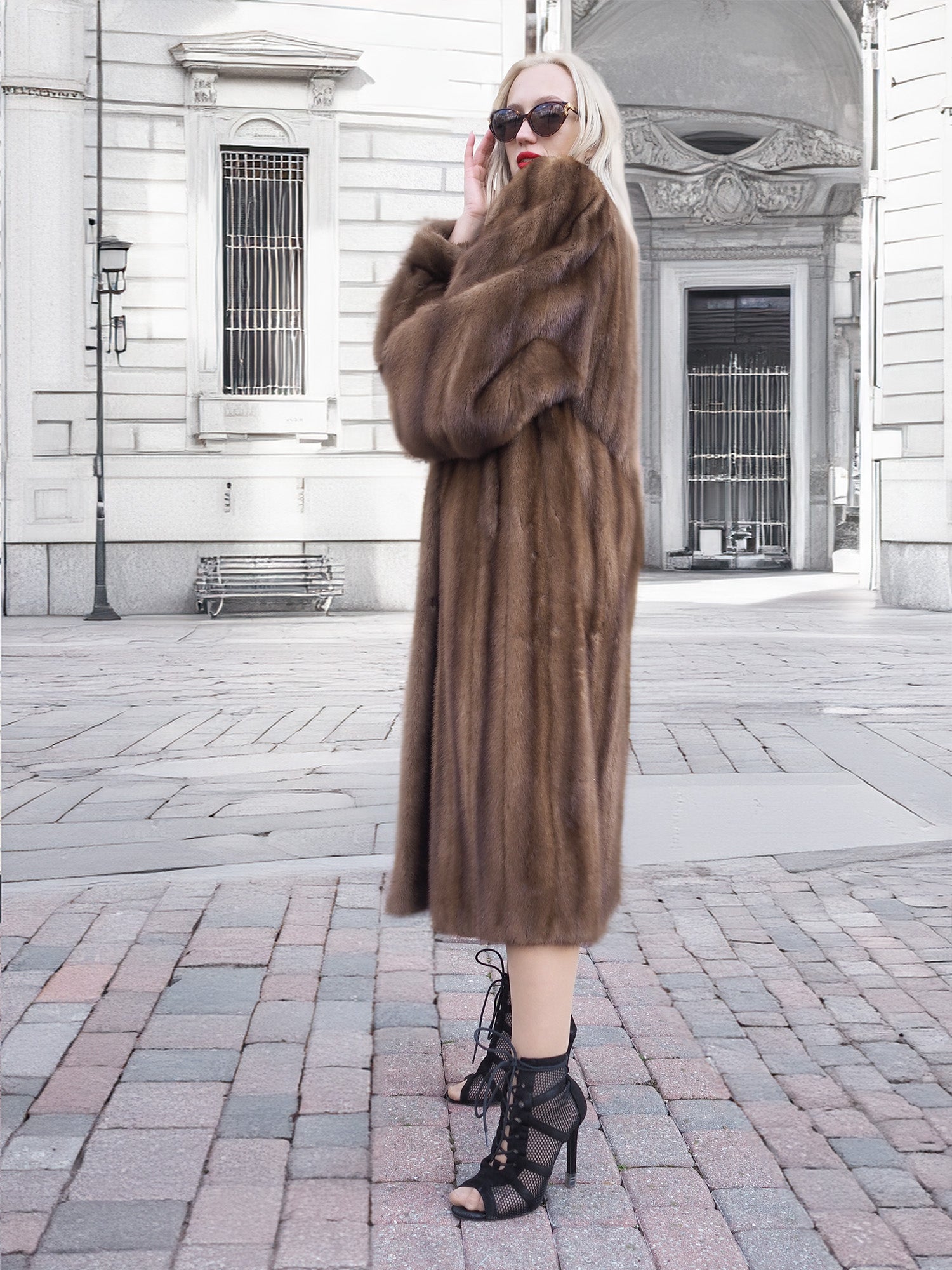 Luxurious pastel-hued Canadian brown mink fur coat with silk lining, worn by a fashionable woman on a city street.