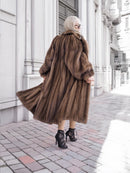 Luxurious pastel Canadian brown mink fur coat with silk lining, showcasing elegance and sophistication.