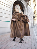 Vintage pastel brown Canadian mink fur coat with silk lining, showcased on the streets.