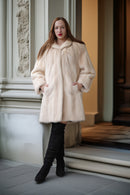 Pearl Mink Coat with swing silhouette, cream color, plush hooded collar and front pockets